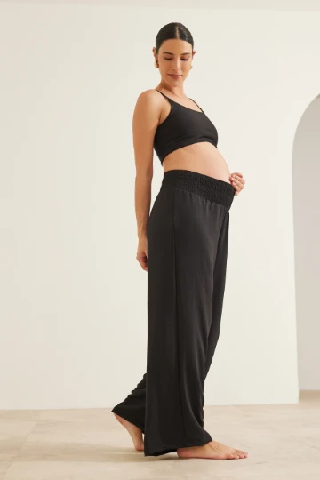 CALÇA GESTANTE E PÓS-PARTO SOLTINHA COM LASTEX